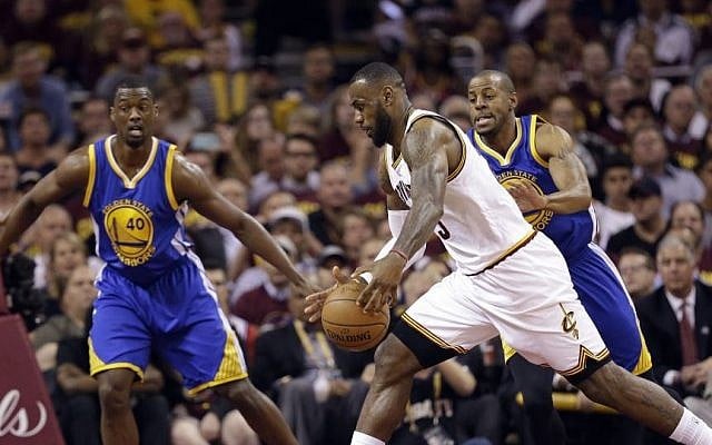 Cleveland Cavaliers forward LeBron James (23) drives on Golden State Warriors forward Harrison Barnes (40) and guard Andre Iguodala (9) during the first half of Game 6 of basketball's NBA Finals in Cleveland, Tuesday, June 16, 2015. (AP/Tony Dejak) Cleveland Cavaliers forward LeBron James (23) drives on Golden State Warriors forward Harrison Barnes (40) and guard Andre Iguodala (9) during the first half of Game 6 of basketball's NBA Finals in Cleveland, Tuesday, June 16, 2015. (AP/Tony Dejak)