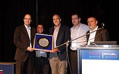 Qlight was awarded the Chief Scientist's prize for nanotechnology at the Israel Nanotech event in March 27 2014. (L to R) Chief Scientist of the Ministry of Economy of the State of Israel, Dr. Avi Hasson, Qlight Nanotech's VP R&D, Professor Uri Banin, Qlight Nanotech's founder and CTO, Yaacov Michlin, CEO of Yissum and Chairman of the Board of Qlight Nanotech, and Dr. Volker Hilarius, Director International Projects at Merck. (Courtesy)