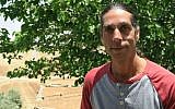 Noam Cohen, one of the founders of the hilltop community of Neve Erez. (Luke Tress/Times of Israel)