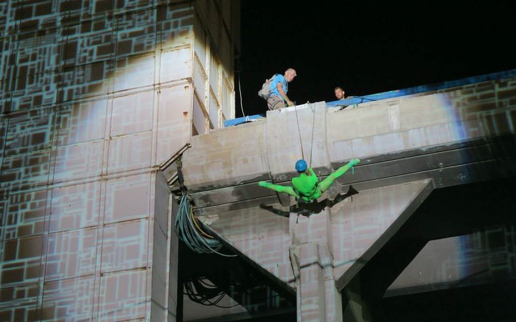 Rappelling down the side of Tel Aviv's Central Bus Station during White Night (Courtesy Brandon Berry)