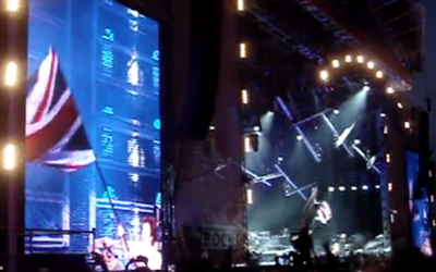 Paul McCartney waves a Union Jack at a concert in London in 2011 (YouTube screenshot)