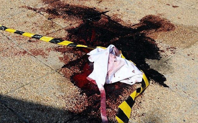 Blood and material on the ground near the area where a terror attack took place in Sousse, Tunisia, Friday June 26, 2015. (AP Photo/Hassene Dridi)