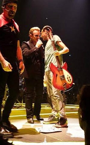 Ryan Luxenberg (right) confers with Bono as The Edge stands to the left, Montreal, June 16, 2015. (Courtesy)