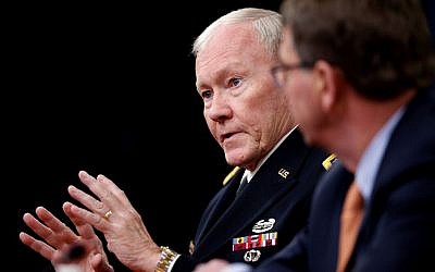 Joint Chiefs Chairman Gen. Martin Dempsey, left, accompanied by Defense Secretary Ash Carter, speaks during a news conference at the Pentagon, April 16, 2015 (AP Photo/Andrew Harnik, File)