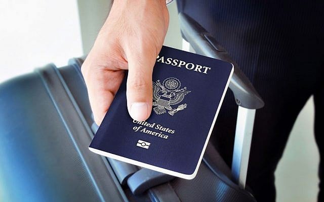 Illustrative: Man holding a US passport. (Shutterstock)