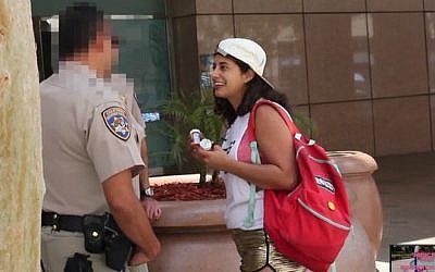 Comedic filmmaker Jessie Kahnweiler tries to sell prescription drugs to some Los Angeles police officers in her 'Jessie Gets Arrested' video. (YouTube screen capture)