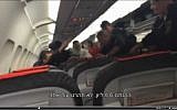 Israeli Yossi Davidov arguing with police officers on Austrian Airlines flight OS859 in Vienna, June 16, 2015. (Screen capture)