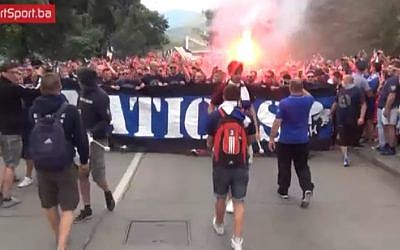 Bosnian soccer fans chant 'Palestine' at a protest in front of the hotel where players from the Israeli National Team were staying in Zenica, Bosnia, JUne 12, 2015, ahead of a Euro 2016 qualifier match between the two teams. (Screenshot) 