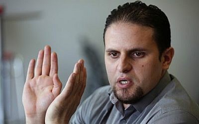 Former Guantanamo detainee and al-Qaeda trainee Mourad Benchellali talks during an interview with the Associated Press in Gennevilliers, suburban Paris, France, on May 13, 2015. (AP/Remy de la Mauviniere)