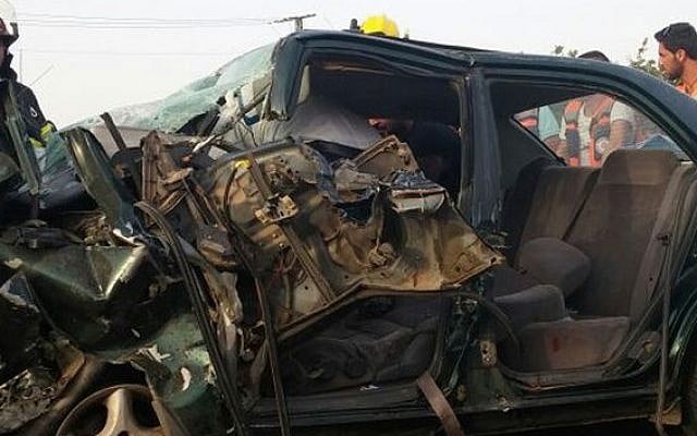 The wrecked vehicle in which a mother and two of her children were killed in a car accident, June 1, 2015. Her husband and another daughter were both seriously injured. (Northern District Firefighters spokesperson) The wrecked vehicle in which a mother and two of her children were killed in a car accident, June 1, 2015. Her husband and another daughter were both seriously injured. (Northern District Firefighters spokesperson)