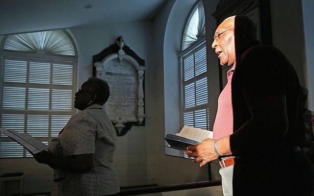 Mourners sing hymns during a community prayer service for the nine victims of last night's shooting at the historic Emanuel African Methodist Episcopal Church, at Second Presbyterian Church June 18, 2015 in Charleston, South Carolina. (Chip Somodevilla/Getty Images via JTA) Mourners sing hymns during a community prayer service for the nine victims of last night's shooting at the historic Emanuel African Methodist Episcopal Church, at Second Presbyterian Church June 18, 2015 in Charleston, South Carolina. (Chip Somodevilla/Getty Images via JTA)
