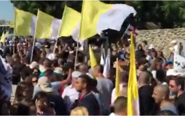 Thousands rally outside the Church of the Multiplication in northern Israel on June 21, 2015. The church was torched and daubed with anti-Christian graffiti on June 18, 2015. (Screen capture: Walla news) Thousands rally outside the Church of the Multiplication in northern Israel on June 21, 2015. The church was torched and daubed with anti-Christian graffiti on June 18, 2015. (Screen capture: Walla news)