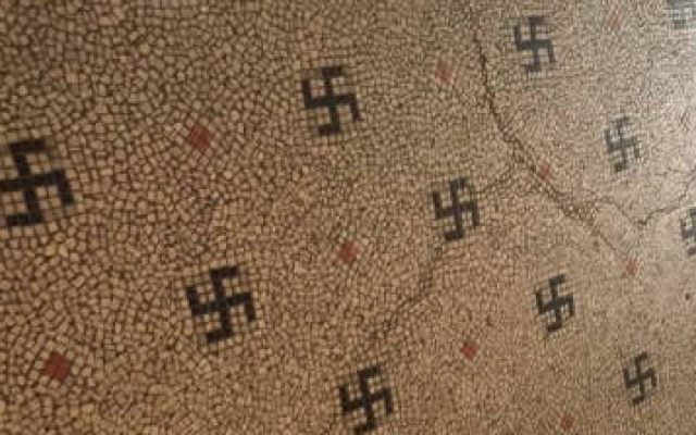 The floor of the entrance of the building in Paris’ six arrondissement contains dozens of swastikas made of black mosaic and incorporated at regular intervals into the floor’s pattern. (JTA/BNVCA) The floor of the entrance of the building in Paris’ six arrondissement contains dozens of swastikas made of black mosaic and incorporated at regular intervals into the floor’s pattern. (JTA/BNVCA)