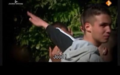 Muslim youths in The Netherlands mocking a Jewish man (Screen capture: YouTube)