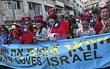 A group of Taiwanese visitors march in the 'Tabernacles' parade held by Christian groups each year on the Jewish holiday of Sukkot, September 24, 2013. (Nati Shohat/Flash90)