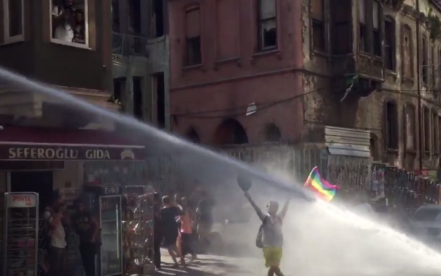 Turkish riot police use water cannon on a gay rights demonstrator during a Gay Pride parade, Istanbul, Turkey, June 28, 2015. (Twitter/David Lepeska) Turkish riot police use water cannon on a gay rights demonstrator during a Gay Pride parade, Istanbul, Turkey, June 28, 2015. (Twitter/David Lepeska)