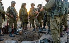 IDF infantrymen congregating around a tunnel entrance in Gaza, July 24, 2014. (Courtesy IDF Flickr)