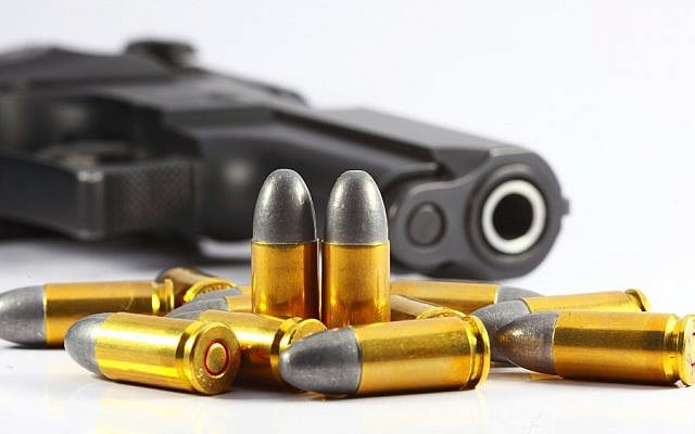 Illustrative image of a gun and bullets. (A gun and bullets via Shutterstock) Illustrative image of a gun and bullets. (A gun and bullets via Shutterstock)