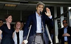 US Secretary of State John Kerry waves after speaking to media as he is discharged from Massachusetts General Hospital Friday, June 12, 2015, in Boston (AP/Elise Amendola)