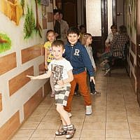 Children running in the hallway of the Zaporozhye JCC, May 20, 2015. (photo credit: Anna Moskalkova/WJR)