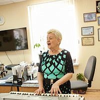 A local woman playing the piano at the Jewish Community Center of Zaporozhye, May 20, 2015. (photo credit: Anna Moskalkova/WJR)