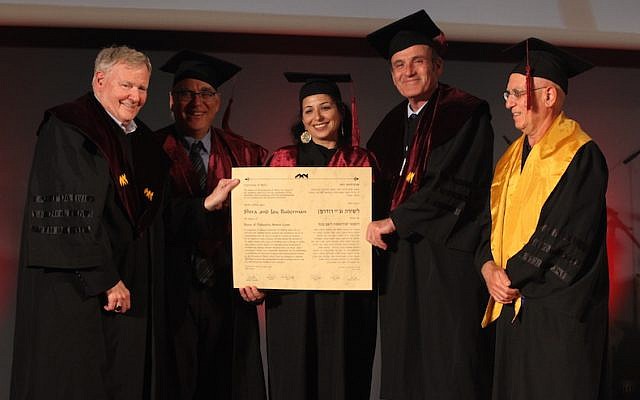 Haifa University President Amos Shapira (left) presents honorary Ph.D degrees to Shira and Jay Ruderman (center, second right) (Gil Hadani) Haifa University President Amos Shapira (left) presents honorary Ph.D degrees to Shira and Jay Ruderman (center, second right) (Gil Hadani)
