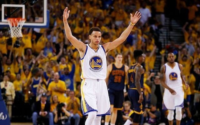 Stephen Curry of the Golden State Warriors celebrates during Game Two of the 2015 NBA Finals at ORACLE Arena in Oakland, California on June 7, 2015 (Ezra Shaw/Getty Images/via JTA)