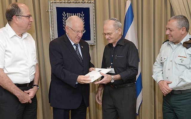 Israel Shrir, 79 (2-R), receives a citation for excellence from Defense Minister Moshe Ya'alon (L), President Rivlin (2-L) and Chief of Staff Gadi Eisenkot (R), Monday June 8, 2015. (Mark Neyman/GPO) Israel Shrir, 79 (2-R), receives a citation for excellence from Defense Minister Moshe Ya'alon (L), President Rivlin (2-L) and Chief of Staff Gadi Eisenkot (R), Monday June 8, 2015. (Mark Neyman/GPO)