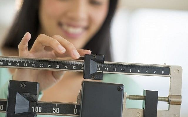 Illustrative photo of a woman on a scale. (Image via Shutterstock) Illustrative photo of a woman on a scale. (Image via Shutterstock)