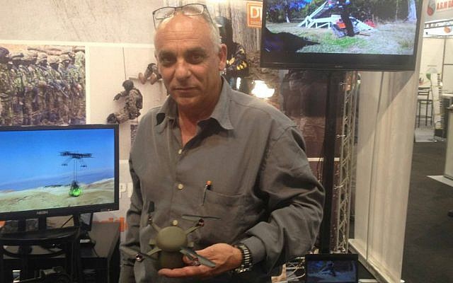 Mirom Kamay of SKK UAV with the still unnamed, palm-sized drone (Mitch Ginsburg/ Times of Israel)