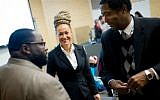 Rachel Dolezal (center), Spokane's NAACP president, meets with Joseph M. King, of King's Consulting (left), and Scott Finnie (right), director and senior professor of Eastern Washington University's Africana Education Program, before the start of a Black Lives Matter Teach-In on Public Safety and Criminal Justice, in Cheney, Washington, January 16, 2015. (Tyler Tjomsland/The Spokesman-Review via AP, File)