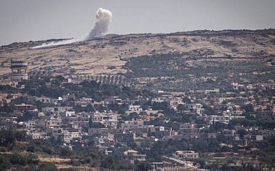 Illustrative: An explosion on the Syrian Golan Heights on June 16, 2015, as the al-Nusra Front fights against Assad's troops near the Syrian Druze village of Hader. (Basel Awidat/Flash90)