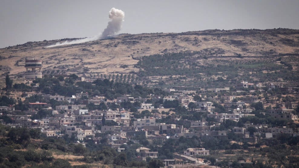 An explosion on the Syrian Golan Heights on June 16, 2015, as the al-Nusra Front fights against Assad's troops near the Syrian Druze village of Hader. (Basel Awidat/Flash90) An explosion on the Syrian Golan Heights on June 16, 2015, as the al-Nusra Front fights against Assad's troops near the Syrian Druze village of Hader. (Basel Awidat/Flash90)
