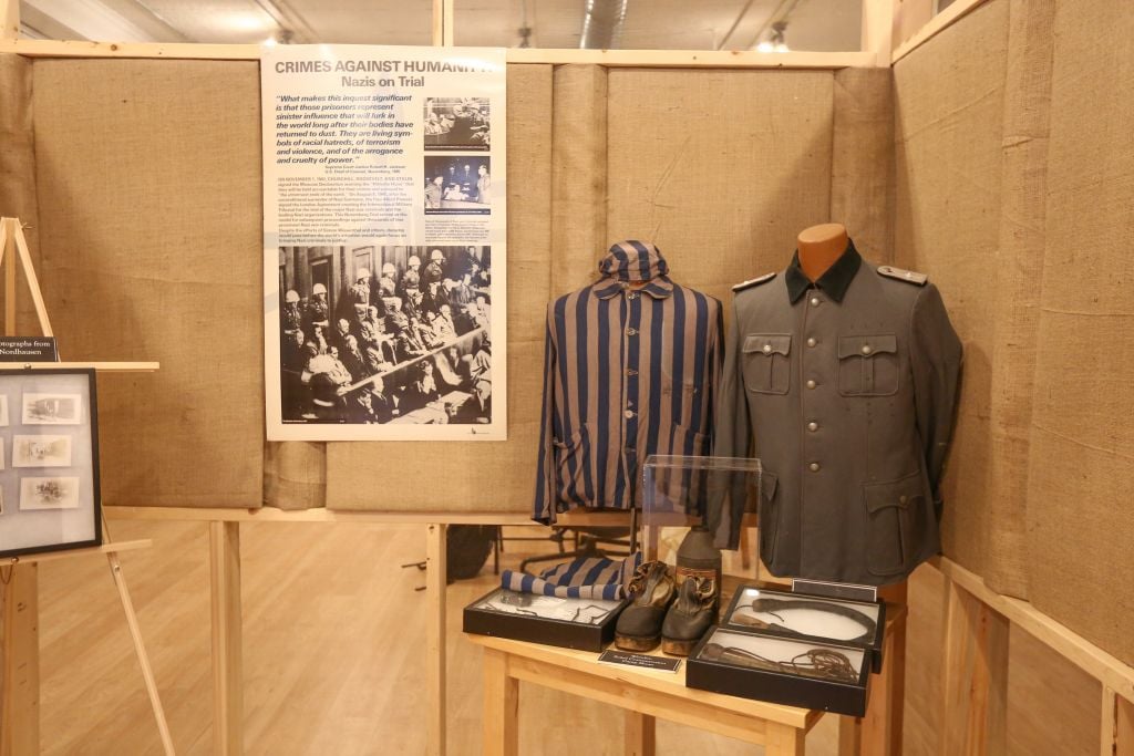 Uniforms and other artifacts from Nazi-era forced labor and death camps, collected and displayed by antiquarian Darrell English, founder of the Massachusetts-based New England Holocaust Institute & Museum (photo credit: Elan Kawesch/The Times of Israel) Uniforms and other artifacts from Nazi-era forced labor and death camps, collected and displayed by antiquarian Darrell English, founder of the Massachusetts-based New England Holocaust Institute & Museum (photo credit: Elan Kawesch/The Times of Israel)