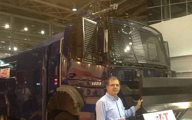 Meir Yakter, alongside Beit Alfa Technologies' riot-control vehicle on June 2, 2015 (Mitch Ginsburg/ Times of Israel) Meir Yakter, alongside Beit Alfa Technologies' riot-control vehicle on June 2, 2015 (Mitch Ginsburg/ Times of Israel)