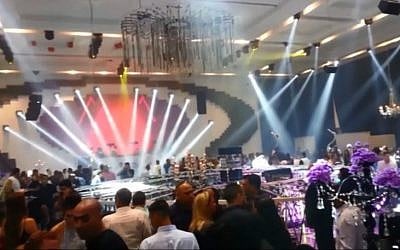 The ADIA event hall in Yavneh, moments after a lighting fixture collapsed at the scene, Tuesday, June 23, 2015 (screen capture: YouTube)
