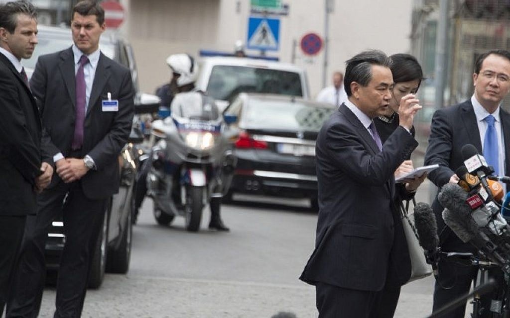 China's Foreign Minister Wang Yi speaks to journalists as he arrives at the Palais Coburg Hotel where the Iran nuclear talks meetings are being held in Vienna, Austria on July 6, 2015. (Joe Klamar/AFP)