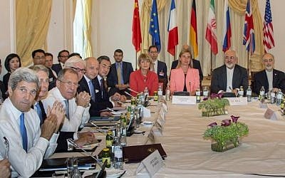 US Secretary of State John Kerry (L-R), British Foreign Minister Philip Hammond, Russian Foreign Minister Sergey Lavrov, German Foreign Minister Frank-Walter Steinmeier, French Foreign Minister Laurent Fabius, China's Foreign Minister Wang Yi, EU Secretary General for the External Action Service, Helga Schmid, High Representative of the European Union for Foreign Affairs and Security Policy, Federica Mogherini, Iranian Foreign Minister Mohammad Javad Zarif and Iran's ambassador to IAEA, Ali Akbar Salehi, meet at the table at the Palais Coburg Hotel, where the Iran nuclear talks meetings are being held, in Vienna, Austria on July 6, 2015. (Joe Klamar/AFP)