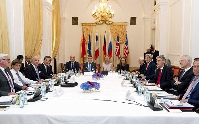 German Foreign Minister Frank-Walter Steinmeier (L), French Foreign Minister Laurent Fabius (3rd L), China's Foreign Minister Wang Yi (4th L), High Representative of the European Union for Foreign Affairs and Security Policy, Federica Mogherini (C), US Secretary of State John Kerry (4th R), British Foreign Minister Philip Hammond (3rd R) and Russian Foreign Minister Sergey Lavrov (R) meet at the table at the Palais Coburg Hotel, where the Iran nuclear talks meetings are being held, in Vienna, Austria on July 7, 2015. (AFP PHOTO / JOE KLAMAR)