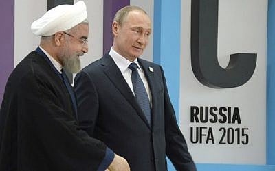 Russia's President Vladimir Putin (R) welcomes Iran's President Hassan Rouhani during the 7th BRICS summit in Ufa on July 9, 2015. (Alexander Nemenov/AFP)