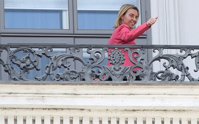 Federica Mogherini ,High Representative of the European Union for Foreign Affairs and Security Policy, gestures from the balcony of the Palais Coburg Hotel located at Theodor Herzl square where the Iran nuclear talks meetings are being held in Vienna, Austria on July 13, 2015. (AFP/JOE KLAMAR)