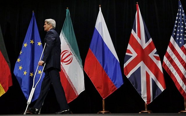 US Secretary of State John Kerry leaves the stage after a group picture with foreign ministers and representatives from China, Iran, Britain, Germany, France, and the European Union at the Vienna International Center in Vienna, Austria July 14, 2015. (AFP/POOL/CARLOS BARRIA) US Secretary of State John Kerry leaves the stage after a group picture with foreign ministers and representatives from China, Iran, Britain, Germany, France, and the European Union at the Vienna International Center in Vienna, Austria July 14, 2015. (AFP/POOL/CARLOS BARRIA)