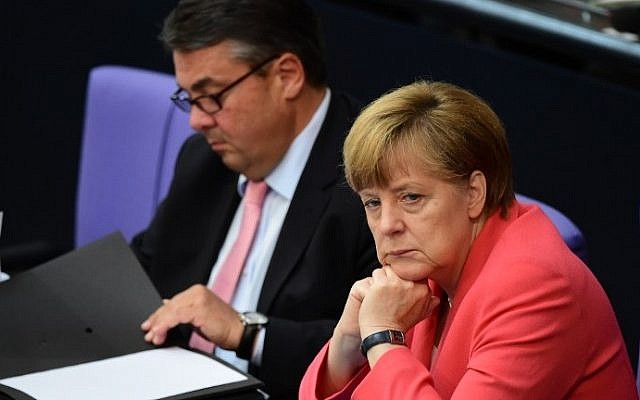 German Chancellor Angela Merkel (right) and Economy Minister Sigmar Gabriel (left) listen to a debate in the Bundestag, the German lower house of parliament in Berlin, on July 17, 2015. (John McDougall/AFP) German Chancellor Angela Merkel (right) and Economy Minister Sigmar Gabriel (left) listen to a debate in the Bundestag, the German lower house of parliament in Berlin, on July 17, 2015. (John McDougall/AFP)