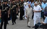 Indian Prime Minister Narendra Modi, right, and President Pranab Mukherjee seen surrounded by members of staff in New Delhi, July 28, 2015. (AFP/PRAKASH SINGH)