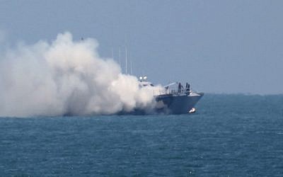 A picture shows smoke billowing from an Egyptian naval vessel on the maritime border between Egypt and the Gaza Strip on July 16, 2015.  (AFP/SAID KHATIB)