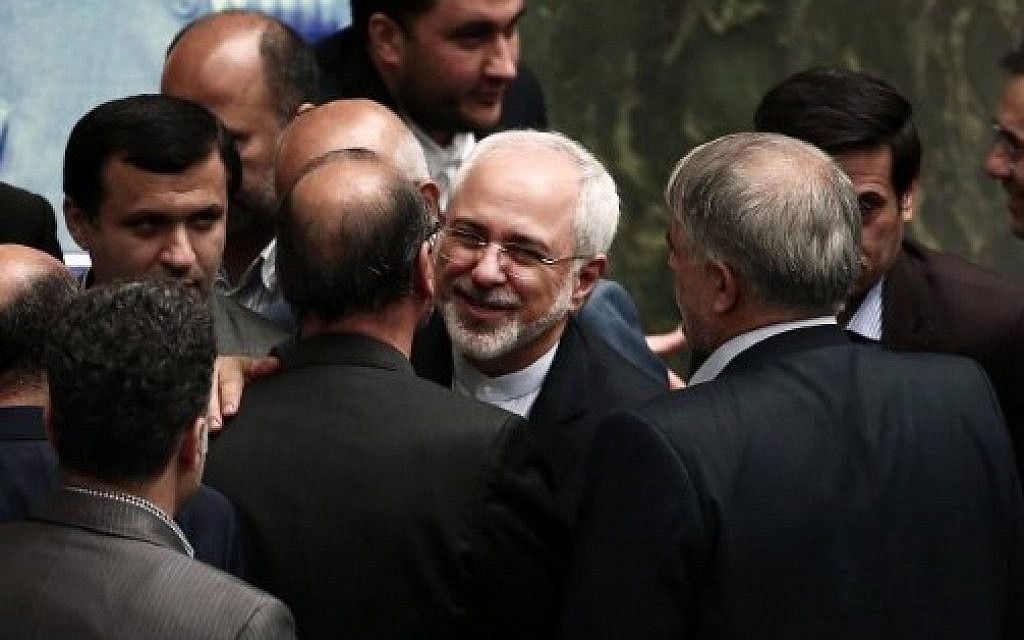 Iran's Foreign Minister Mohammad Javad Zarif (C) embraces the MPs after delivering his speech in the parliament in Tehran on July 21, 2015 (AFP/BEHROUZ MEHRI)