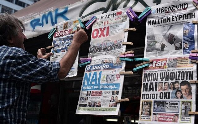 A newsagent hangs newpapers bearing "No" and "Yes" headlines in central Athens, on July 4, 2015, on the eve of the Greek referendum on its bailout terms. (AFP/ LOUISA GOULIAMAKI) A newsagent hangs newpapers bearing "No" and "Yes" headlines in central Athens, on July 4, 2015, on the eve of the Greek referendum on its bailout terms. (AFP/ LOUISA GOULIAMAKI)