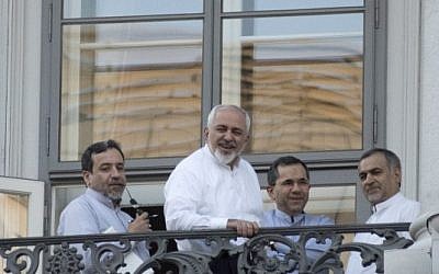(From L) Iranian Deputy Foreign Minister Abbas Araqchi, Iranian Foreign Minister Mohammad Javad Zarif, Iran's deputy foreign minister for European and American Affairs, Majid Takht-Ravanchi, and Hossein Fereydoun, the brother of the Iranian president gather onto a balcony of the Palais Coburg Hotel, where the Iran nuclear talks meetings are being held in Vienna on July 11, 2015.  (AFP PHOTO / JOE KLAMAR)