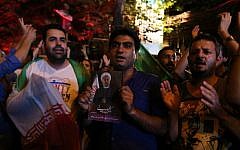 Iranians celebrate in northern Tehran, on July 14, 2015, after Iran's nuclear negotiating team struck a deal with world powers in Vienna. (AFP Photo/Atta Kenare)