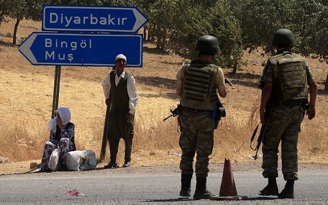 Illustrative: Turkish soldiers wait at a check point in Diyarbakir on July 26, 2015. (AFP/Ilyas Akengin)